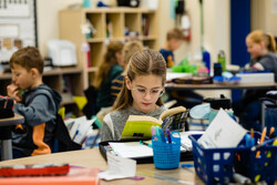 girl reading at desk