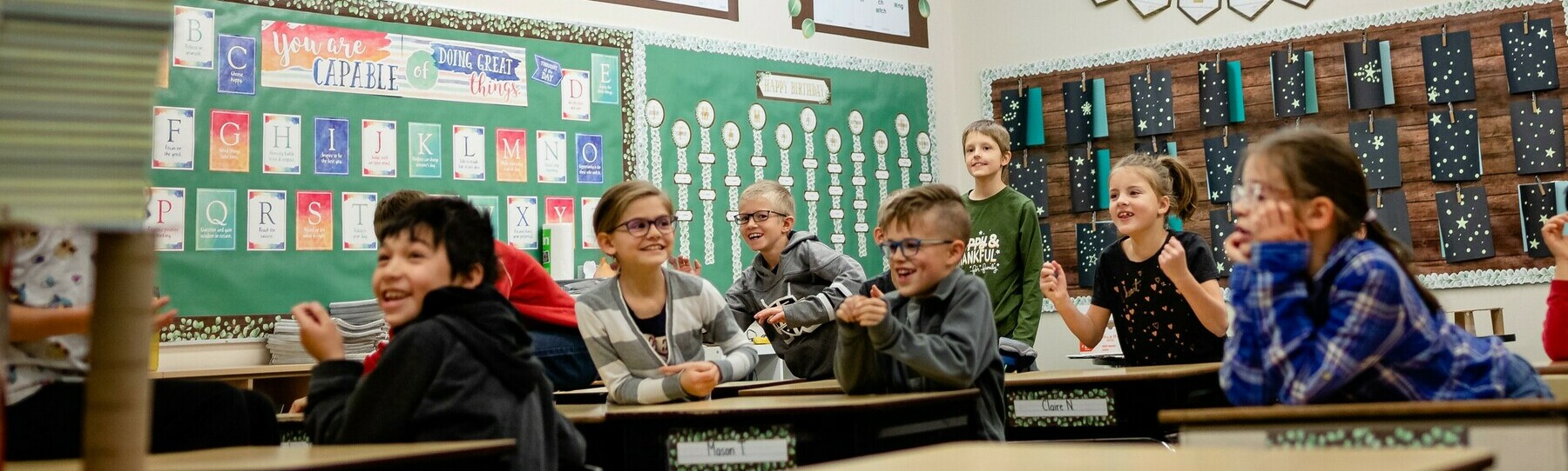 kids at desks in classroom